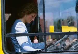 Princess Diana, Princess of Wales at the wheel of a bus during a visit to the Walter