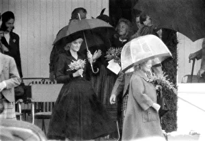 00084 Prints: Princess Diana and The Queen Mother hide underneath their umbreallas during a heavy