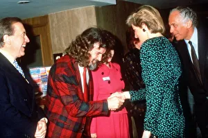 Princess Diana shakes hands with Scottish comedian Billy Connolly