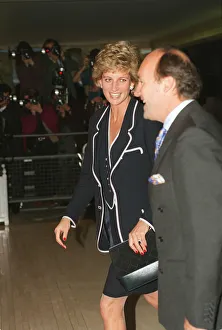 PRINCESS DIANA, SMILING, AND AN UNKNOWN MAN ARRIVE AT A FUNCTION - 05 / 06 / 1995