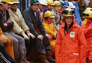 Images Dated 3rd September 1985: Princess Diana wearing a construction hard hat with protective ear guards