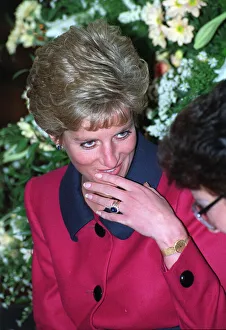 PRINCESS DIANA WEARING RED AND NAVY BLUE DRESS - F / L, SEATED - DECEMBER 1990