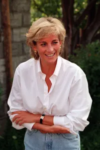 PRINCESS DIANA WEARING WHITE SHIRT AND JEANS DURING HER VISIT TO Bosnia - Herzegovina AS