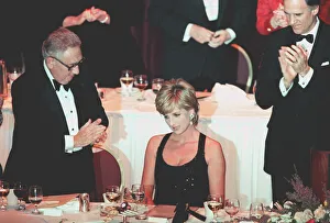 PRINCESS DIANA WEARS A BLACK EVENING DRESS AND RECEIVES A HUMANITARIAN AWARD AT AN EVENT