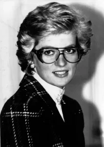 Princess Diana wears safety goggles and a Catherine Walker suit during a visit to a