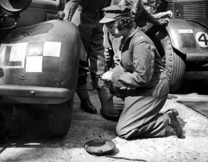 Princess Elizabeth learning basic car maintenance as a Second Subaltern in the A. T