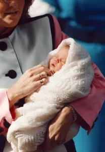 00178 Prints: Princess Eugenie being held by her mother Sarah Ferguson as they leave Portland Hospital