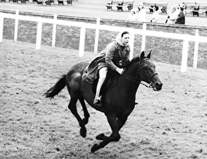 Head Scarf Prints: Princess Margaret riding a horse at Ascot before spectators arrive for meeting