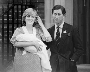Princess of Wales holds her new born baby son William and Prince Charles at St. Marys Hospital