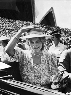 Commonwealth Prints: The Princess of Wales pulls a funny face as a bouquet of flowers hits her on the head