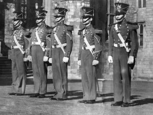 00084 Prints: Private First Class James M. Kelly (left) wearing the historic uniform of the famous
