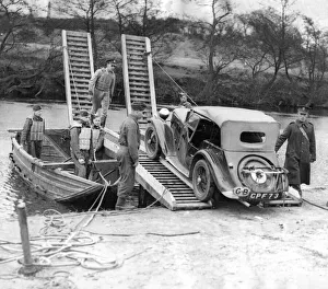 00066 Prints: The problem of transporting a car across a river is soon solved by Royal lEngineers with