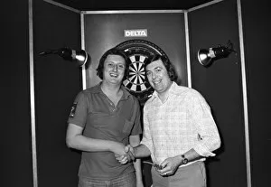 Images Dated 12th March 1978: Professional British dart player Eric Bristow poses with winner John Lowe after finishing