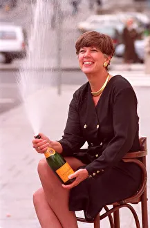 PRUE LEITH, WITH BOTTLE OF CHAMPAGNE, IN PHOTOCALL TO CELEBRATE BUSINESSWOMAN OF