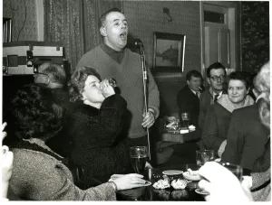 Microphone Prints: Pub singer paraffin lamp pub bar Glasgow Scotland 1961 Scotland archive