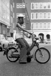 00055 Prints: Publicity Dept: Girl on Bicycle. September 1975 75-04942-001