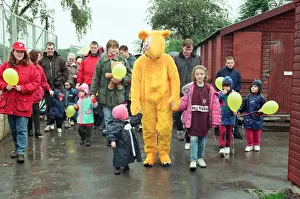Bear Prints: Pudsey Bear leads the toddlers round the park during the Great Toddle for Children in