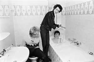 Punk band Sex Pistols relax during their tour of Holland in the hotel bathroom