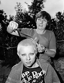 Culture Prints: Punk girl Julie Brandon having her hair cut by her mother at their home in Thame