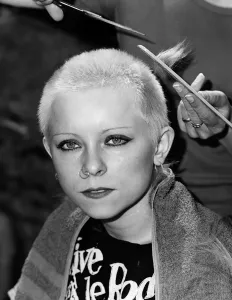 Punk girl Julie Brandon having her hair cut by her mother at their home in Thame