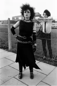 Punk love, Brian McEnaney 15 and Lesley Smith 24 kiss over theschool yard fence