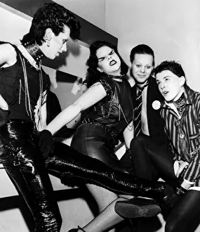 Punk rocker fashion Group of girls and boys in leather trousers wearing school