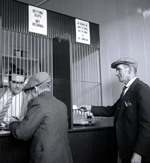 00170 Prints: Punters placing their bets inside William Massie betting shop in Bethnal Green