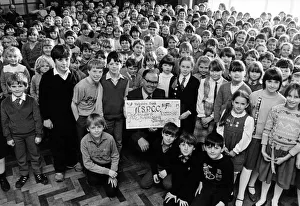 Pupils from Billingham Church of England Junior school hand over a cheque for 1500