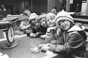 Pupils from Partwood School, Manchester seen here paying money in to their local bank