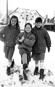 Girls Only Prints: Pupils from St Edwards RC Primary School in Middlesbrough enjoy the sudden snow fall in