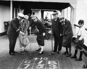 The Purser of the Minnekhada shows our prizewinners how to play Deck Golf