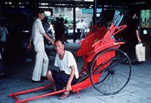 Asian Prints: Push-Push men awaiting customers at Central Station in Hong Kong circa 1980
