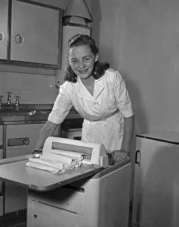 One Woman Only Prints: Quality control seen here testing the mangle on a newly assembled washing machine