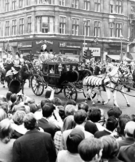 The Queen arrives at the Houses of Parliament in the Irish Coach for the State Opening