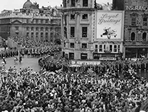 The Queen in her carriage passing through Trafalgar Square on her way to her Coronation