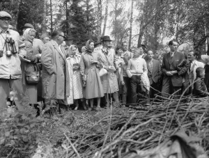 Raincoat Prints: The Queen (centre) seen here with Princess Margaret and members of the Swedish Royal