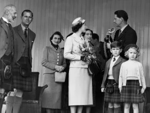 Kilts Prints: The Queen chats with Capt. A. C. Farquharson of Invercauld whilst the Marquess of Aberdeen