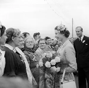 Queen Elizabeth chats with fisher Women at Peel Isle of man with Prince Philip Duke of