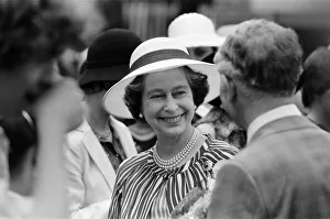 Queen Elizabeth II attends a garden party at Holland House Hostel to mark the Golden