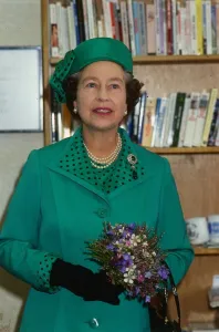 Green Prints: Queen Elizabeth II August 1986 on a visit to Clydebank wearing a green suit black dots