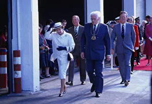 Queen Elizabeth II August 1988 holding on to her hat while Prince Philip Duke of