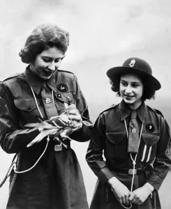 Queen Elizabeth II, Girl Guides Princess Elizabeth and Princess Margaret about to send a
