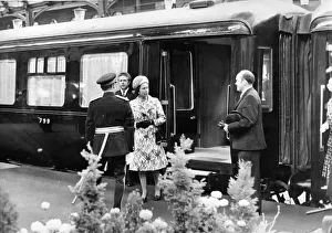 Queen Elizabeth II is greeted by Sir James Steel as she steps from the Royal Train