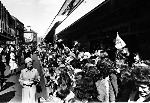 Queen Elizabeth II greets the crowd as she goes walkabout in Wrexham