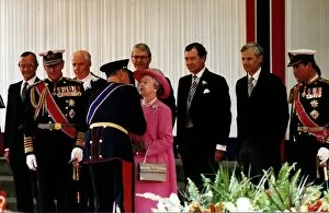 Images Dated 6th July 1994: Queen Elizabeth II King Harald V of Norway kissing Queen pink coat hat Charlotte Square