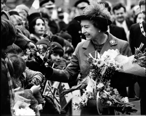 Waves Prints: Queen Elizabeth II meets the happy crowd on her walkabout after opening the Delyn Borough