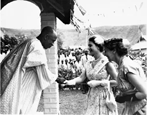 Queen Elizabeth II meets a miner at his home during her tour of the UDI siding housing
