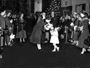 00088 Prints: Queen Elizabeth II is presented with a bouquet by Margaret Elizabeth Brown during a visit
