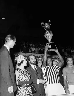 Queen Elizabeth II presented the trophy to Pele after his team Santos played