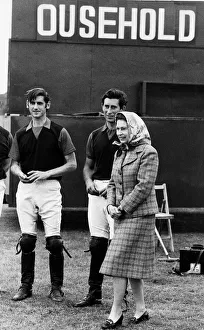Queen Elizabeth II and Prince Charles June 1979 laugh at the score board at a polo